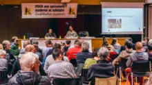 À la tribune du meeting de la Confédération paysanne à la Maison de l’agriculture de Plérin, Emmanuelle Billard et Manu Louail, candidats dans les Côtes d’Armor, entourant Nicolas Girod du syndicat national.